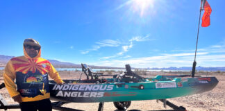 Isac Ochoa Wants You To Know Indigenous Anglers Are Still Here Isac Ochoa stands next to his fishing kayak on Lake Havasu.