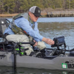 Best Kayak Fish Finders For 2026 Editor Ric Burnley using the fish finder on his kayak.