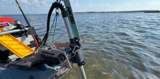 Newport Vessels trolling motor attached to kayak on water.