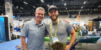 Kayak Angler's Keith Stevenson poses with inaugural YakOff Awards winner Jake Suvak as he receives his championship belt