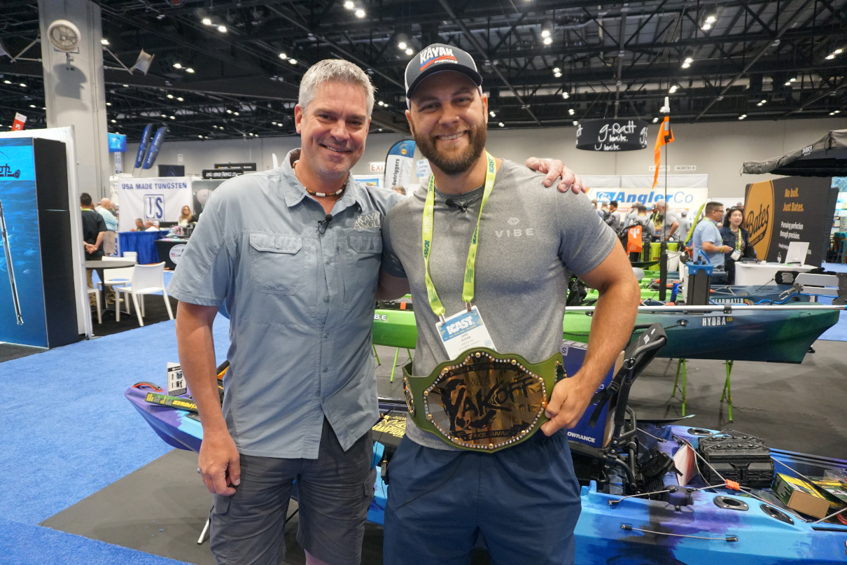 Kayak Angler's Keith Stevenson poses with inaugural YakOff Awards winner Jake Suvak as he receives his championship belt