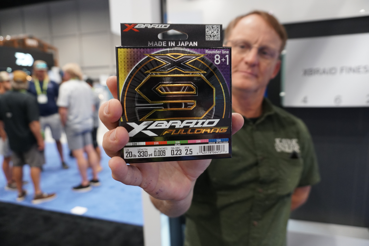 Kayak Angler editor Ric Burnley holds up X-Braid Full Drag fishing line for the camera