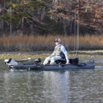 Kayak Angler editor Ric Burnley pilots a fishing kayak outfitted with trolling motor and electric outboard