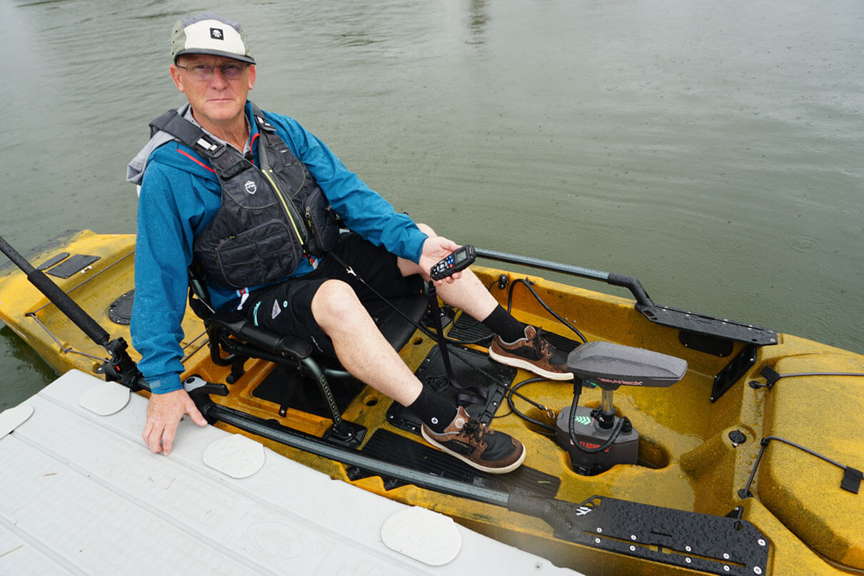 Kayak Angler editor Ric Burnley prepares to test out the YakAttack FluxDrive kayak motor at ICAST 2025