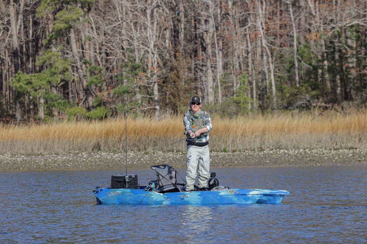 Kayak Angler editor Ric Burnley stands and fishes from the 3 Waters Big Fish 120 PDL fishing kayak