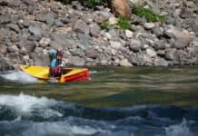 Elements Adventure Company guide and instructor Emily Cole doing what the Ocoee does best—precision paddling
