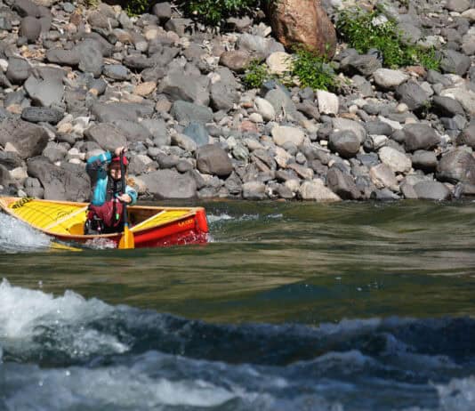 Elements Adventure Company guide and instructor Emily Cole doing what the Ocoee does best—precision paddling