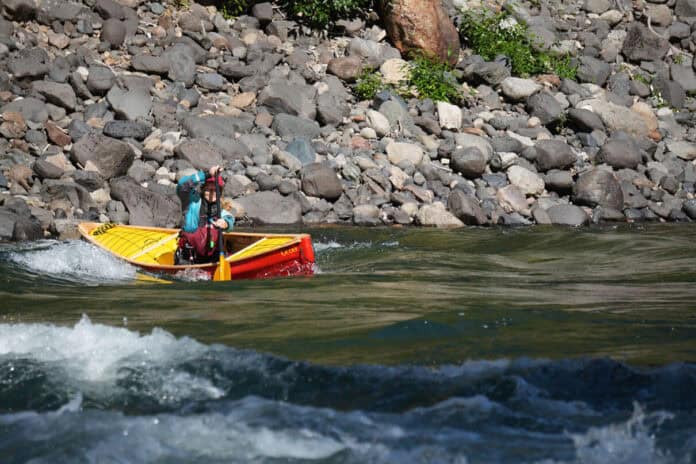 Elements Adventure Company guide and instructor Emily Cole doing what the Ocoee does best—precision paddling