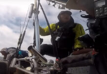 Moo Lee accepts a rescue from his support boat when the weather takes a turn for the worse while fishing offshore.