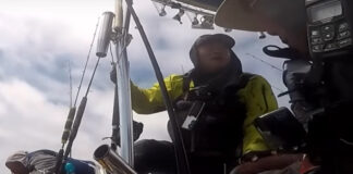 Moo Lee accepts a rescue from his support boat when the weather takes a turn for the worse while fishing offshore.