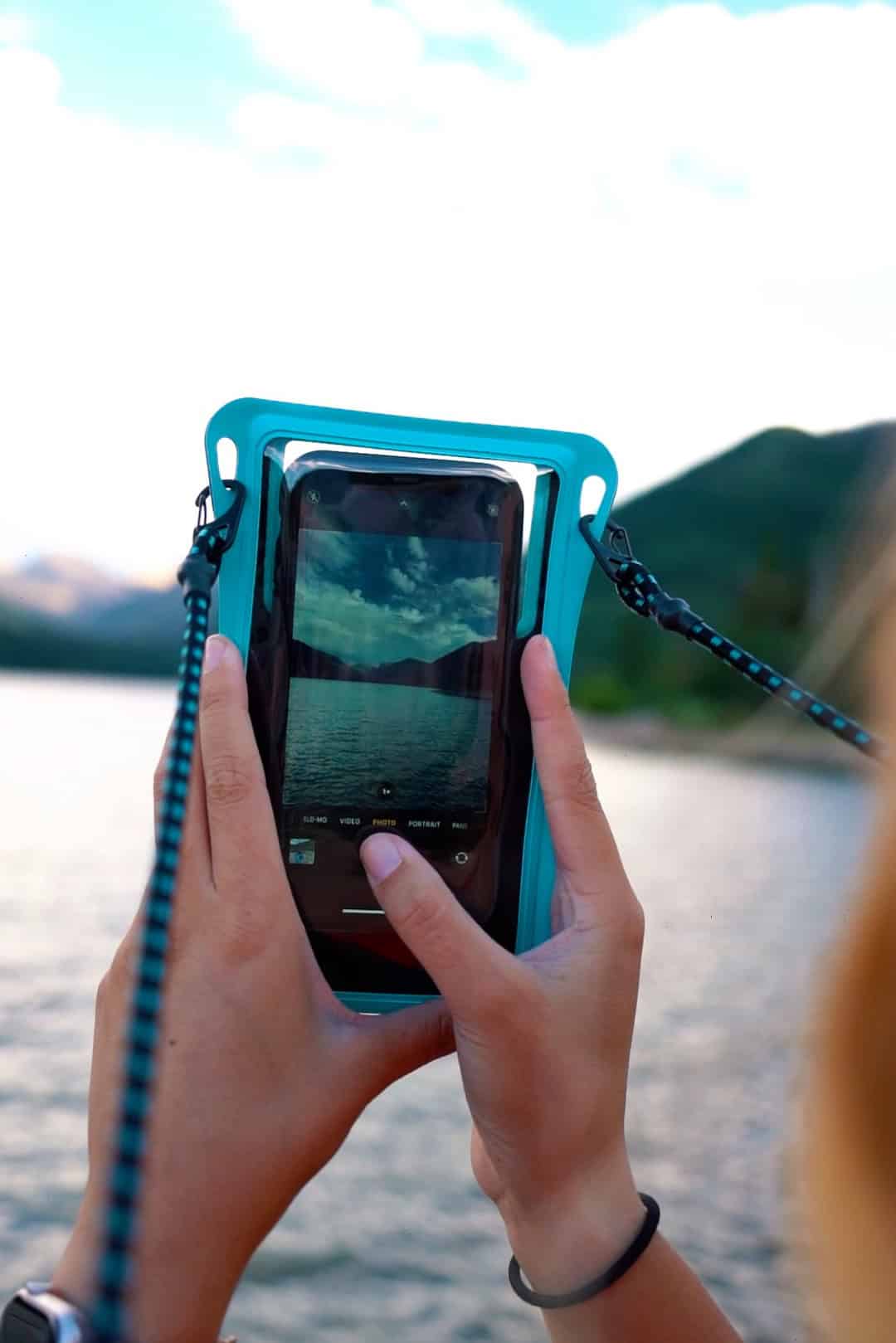 Paddler taking photo with protected phone.
