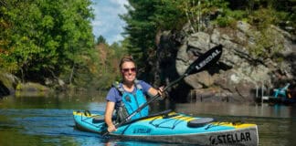Woman paddles Stellar’s three-piece modular S14 G2 light touring kayak