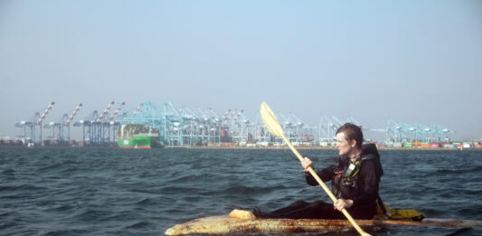 Sam Shoemaker in his mushroom boat entering the Port of Los Angeles on August 5, 2025. | Image: Jordan Freeman / Courtesy Fulcrum Arts