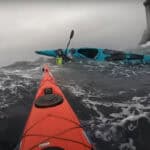 The Bomb-Proof Roll Controversy (Video) image of a capsize in a sea kayak in rough water.