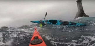 image of a capsize in a sea kayak in rough water.