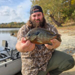 Virginia Level V master angler Josh Dolin holds up a redbreast sunfish
