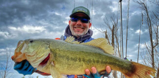 Best Bass Lures For Fall 2025 Man with bass.