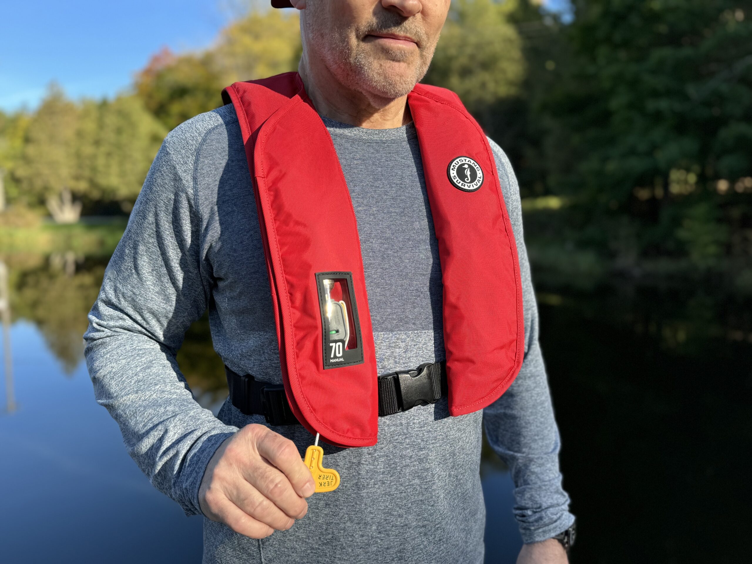 man wearing infltabale fishing PFD