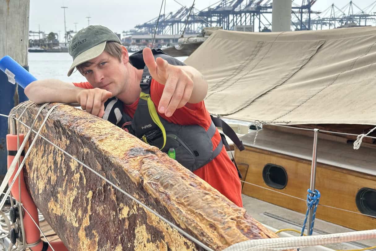Sam Shoemaker preparing his mycelium kayak for the voyage.