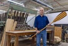 Roustan Sports Ltd. Chairman W. Graeme Roustan holds a paddle in his factory after acquiring Grey Owl Paddles in the brand’s 50th year