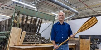 Roustan Sports Ltd. Chairman W. Graeme Roustan holds a paddle in his factory after acquiring Grey Owl Paddles in the brand’s 50th year
