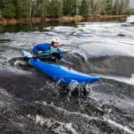 Whitewater Kayak Review: Dagger Indra man paddles the Dagger Indra whitewater kayak in a rapid