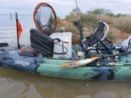DIY kayak livewell setup on a Jackson fishing kayak parked in the flats