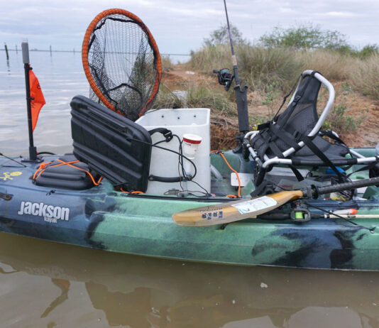 DIY kayak livewell setup on a Jackson fishing kayak parked in the flats