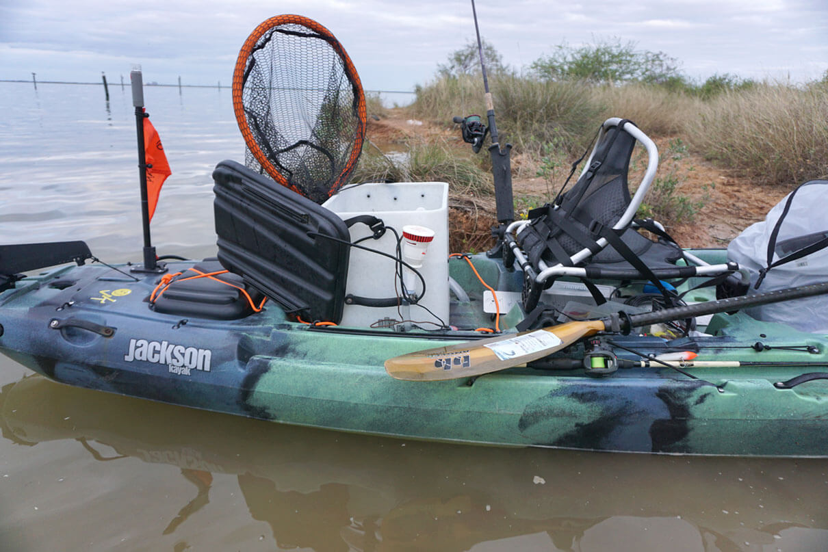 DIY kayak livewell setup on a Jackson fishing kayak parked in the flats