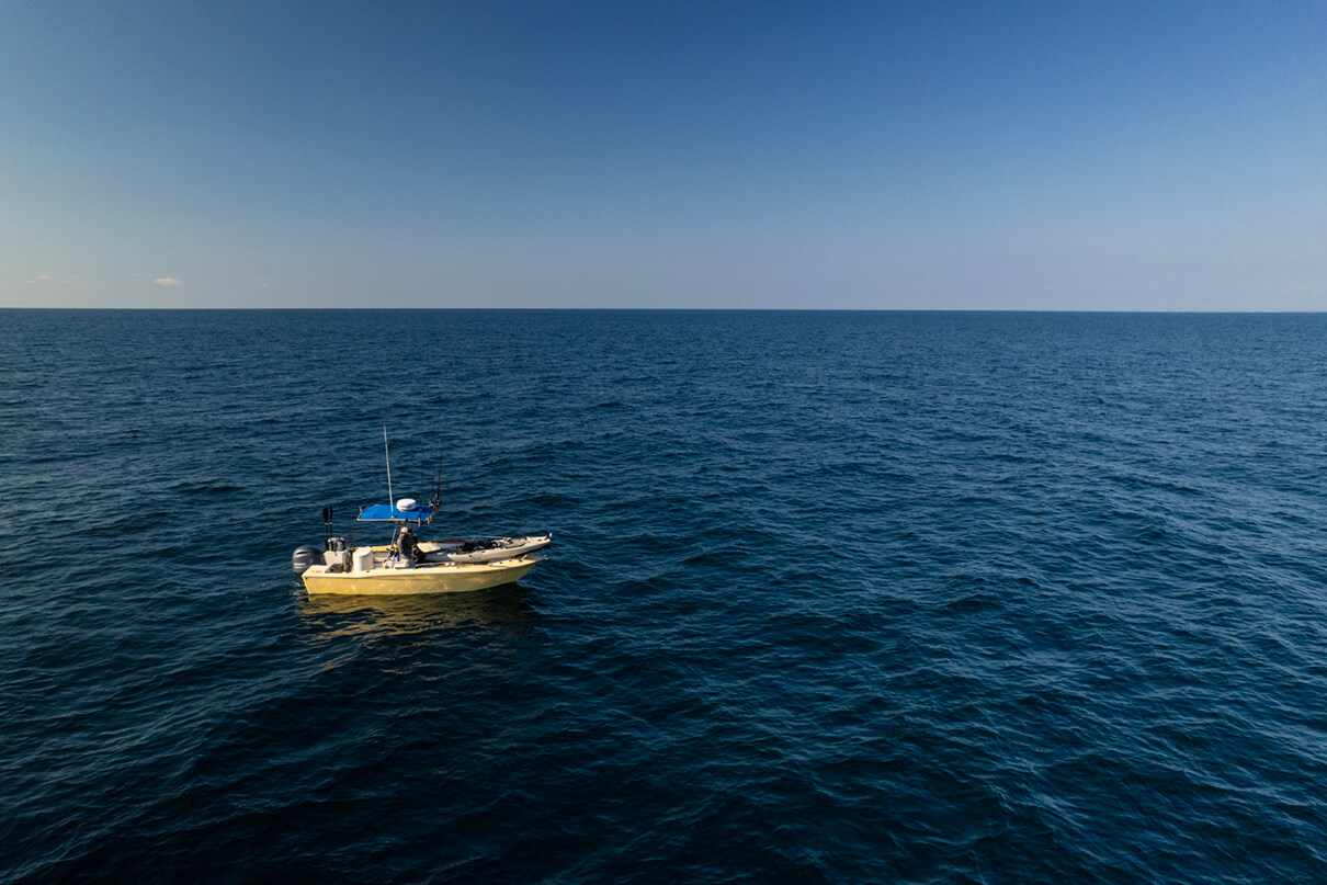 the mothership boat manned by Jeffrey Fortuna with fishing kayak ready to launch