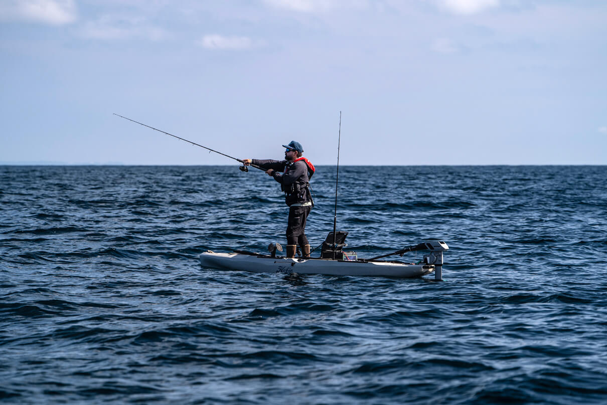 Howie Strech stands and casts from a Hobie Outback for bluefin tuna