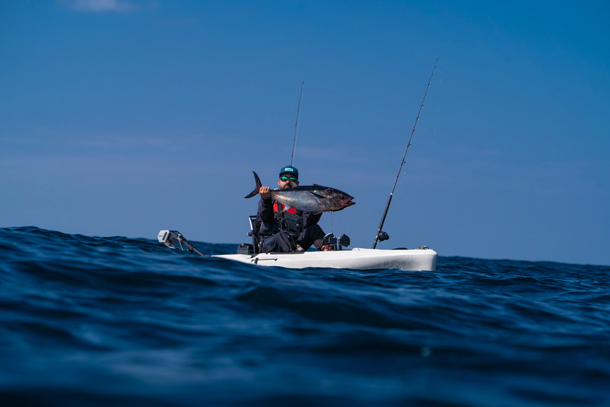 Howie Strech holds up his bluefin tuna catch