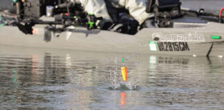 Pro Popping Cork Tactics kayak angler casts a popping cork and it hits the water