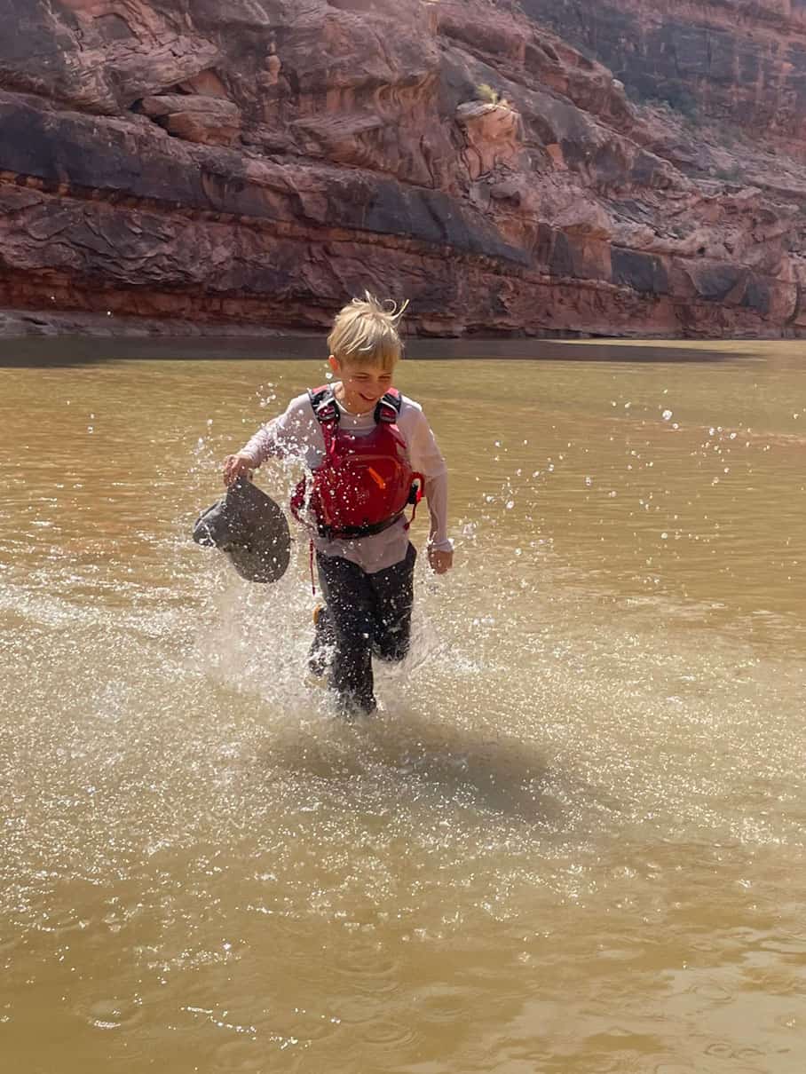 Asa McCallum runs through the San Juan river shallows