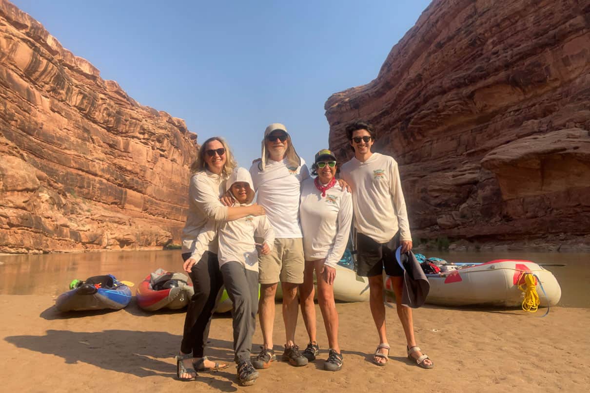 Asa McCallum and family stand in the river canyon