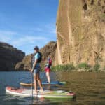 The Best Places To Paddleboard In Arizona Two people on standup paddleboards in Arizona.