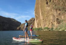 Two people on standup paddleboards in Arizona.