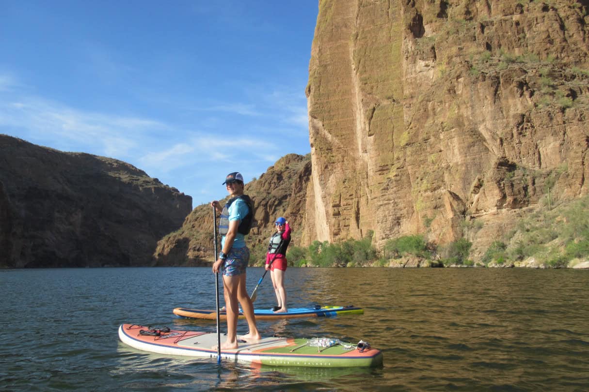 Two people on standup paddleboards in Arizona.