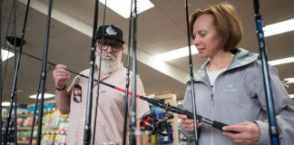 Beginner Bargains: Start Kayak Fishing On A Budget a local tackle shop manager helps a beginner kayak angler to get a good bargain on her purchases