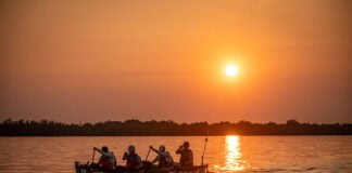 Scott Miller, creator of the Fastest Known Paddle website, is seen in the stern during 2023’s record-setting Mississippi speed run