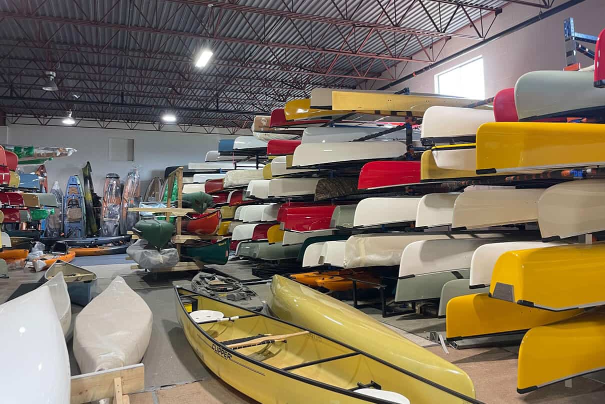 canoes on shelves in a paddlesports retail location