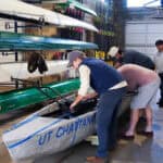 Tennessee Engineering Students Race Concrete Canoes Students prepare a concrete canoe for voyage on the Tenneessee River. The Canoe weighed around 1000 pounds.