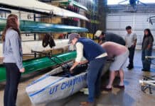 Tennessee Engineering Students Race Concrete Canoes Students prepare a concrete canoe for voyage on the Tenneessee River. The Canoe weighed around 1000 pounds.