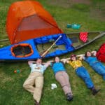 What’s Inside The Hudson Bay Girls’ Expedition Kit four members of the Hudson Bay Girls canoe expedition pose on a lawn with their gear for the trip