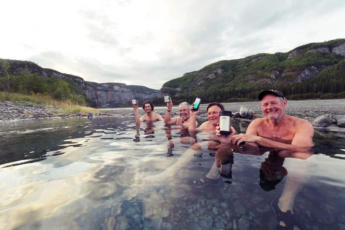 a group of paddlers relax at Kraus Hot Springs