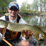 Stop Being A Hater, Learn To Love Pickerel Kyle Hammond holds up a pike he caught while kayak fishing
