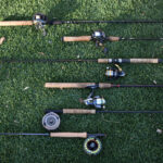 Types Of Fishing Rods—And How To Choose An assortment of different types of fishing rods including spinning rods, baitcasting rods, and fly fishing rods.