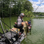 Jake Suvak Wants Kayak Anglers To Get In Shape Jake Suvak poses with a fish for Fit to Fish Challenge. Feature Image courtesy Jake Suvak.