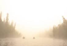 The Canoe Confessional two canoes on a river on a misty day