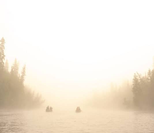 The Canoe Confessional two canoes on a river on a misty day